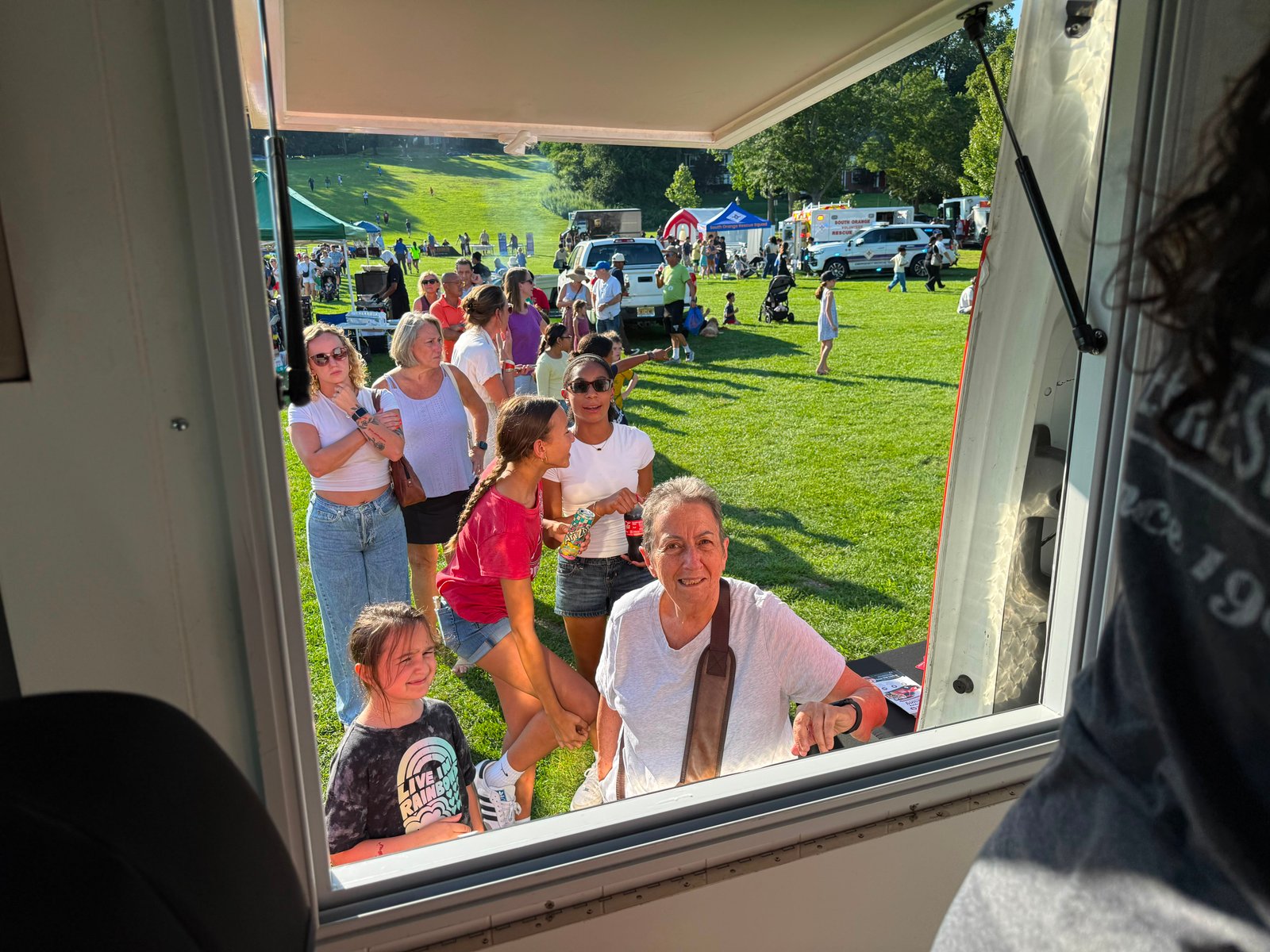A crowd at the Cold Stone truck service window