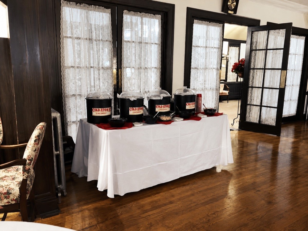 Cold Stone Creamery catering sundae bar set up indoors at an elegant venue